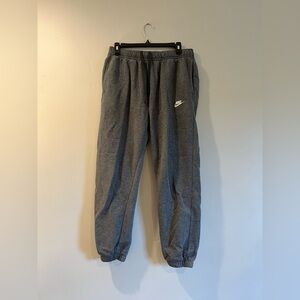 Nike men’s size medium grey sweatpants with adjustable waistband.